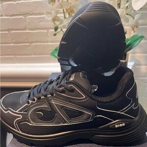 Christian B30s sneakers
White and Black